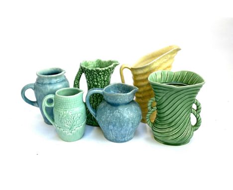 A quantity of Sylvac ware to include Hollyhock jug, twin handled rope vase, Beswick ribbed pitcher 28cmH, Kensingtonware, Tud