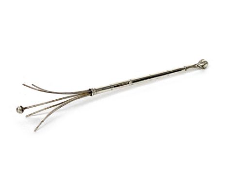 A white metal cocktail swizzle stick, with ball and claw terminal, 8.7cm long when closed