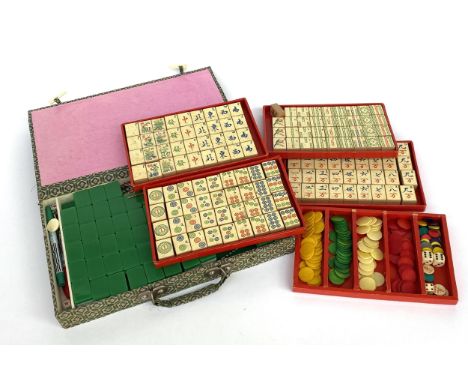 A wooden Mahjong set with 144 pieces and one other
