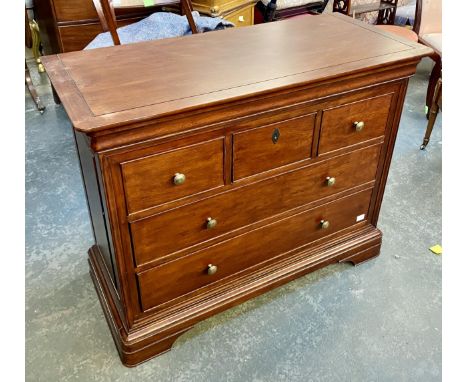 A John Lewis reproduction chest of drawers, having a cushion drawer, over three short and two long drawers, bracket feet, 115
