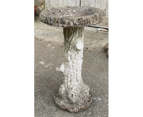A composite stone bird bath, modelled as a tree trunk 40x68cmH