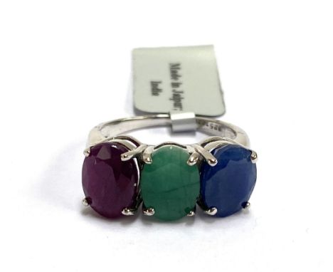 A 925 silver trilogy ring set with sapphire, emerald and a ruby, size O, 4.5g