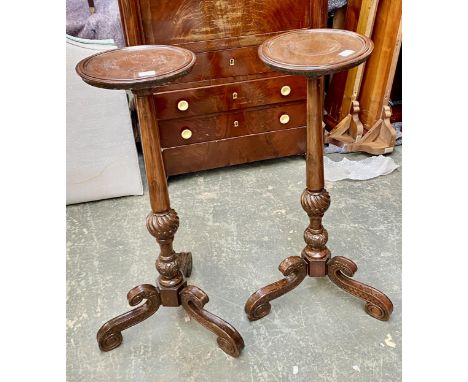 A pair of mahogany pot stands, 20th century, each with circular dish top, on a singular column and scrolling tripod base, 31x