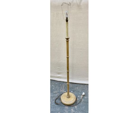 A turned wood standard lamp, 139cmH to base of fitting