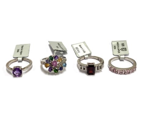 Four new 925 silver and gem set rings, to include an amethyst solitaire, emerald cut garnet and white zircon baguettes, multi