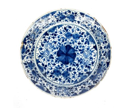 A 19th century blue and white delft charger, 34.5cmD (chips to rim), Bares label for Brisigotti Antiques London W11