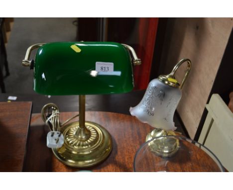 A brass desk lamp with green glass shade and one other with glass shade, lacking lead