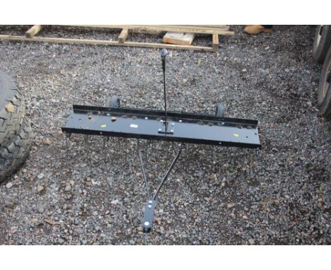 A lawn tractor scarifier 
