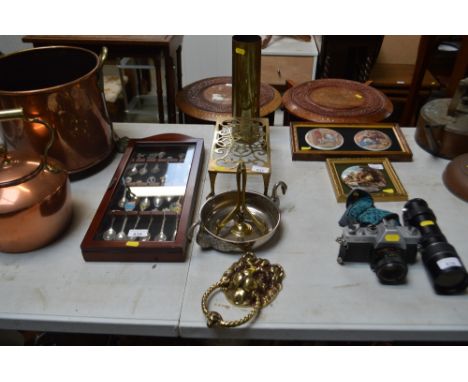 A quantity of brass and plated items to include a door knocker in the form of a lion; brass trivet stand raised on paw feet e