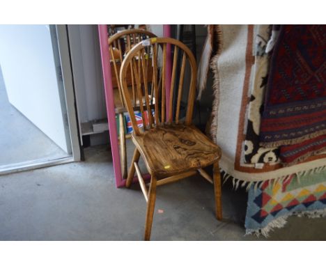 An elm seated stick back chair