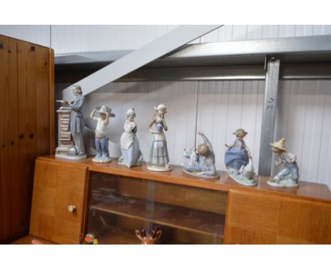 A quantity of Lladro and Nao figures etc