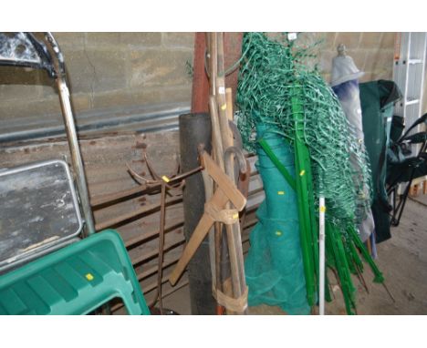 A quantity of long handled garden tools, candle stand and a roll of felt