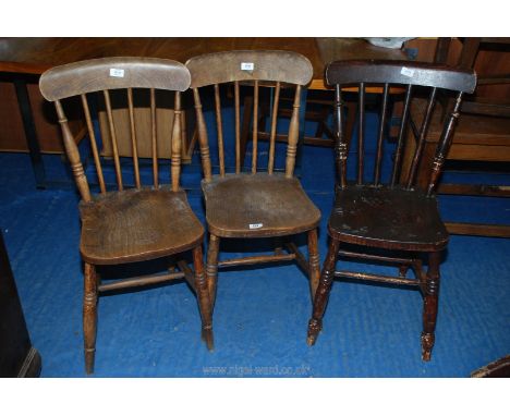 A pair of stick back kitchen chairs plus another similar chair