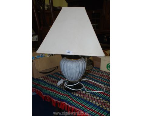 Table lamp with a reeded pottery body and shade