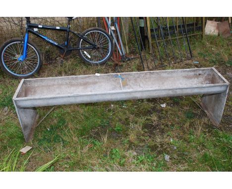 Feeding trough on legs, one drainage hole, 6' long.