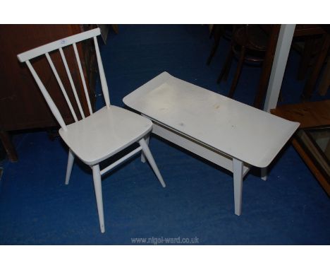 A white finish coffee table and matching stick back chair