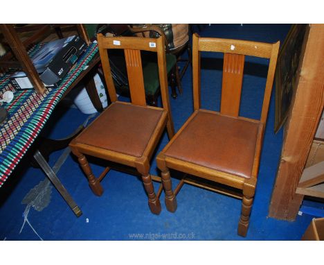 Pair of light oak dining chairs