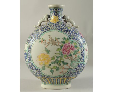 A CHINESE PORCELAIN MOON FLASK with panels of birds and flowers. 14ins high.