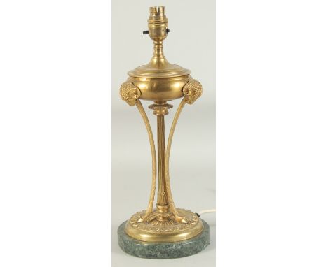 A GOOD 19TH CENTURY BRASS LAMP with ram’s mask and circular marble base. 1ft 3ins high.