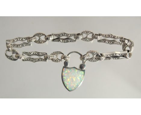 A SILVER OPAL SET BRACELET WITH THISTLE LOCK.