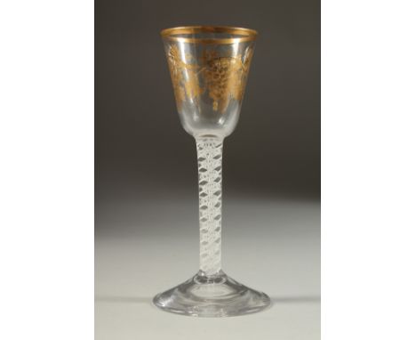 A SUPERB 18TH CENTURY ENGLISH JAMES GILES WINE GLASS, circa 1763, the bowl with fruiting vines in gold, with white short stem