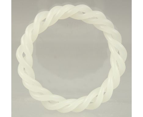 A CHINESE WHITE JADE DOUBLE TWIST BANGLE. 3.25ins diameter.
