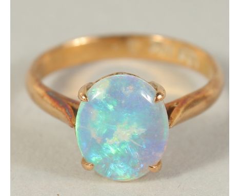 A 14CT GOLD OPAL RING.