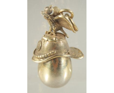 A SMALL RUSSIAN SILVER GILT EAGLE AND HELMET EGG PENDANT.