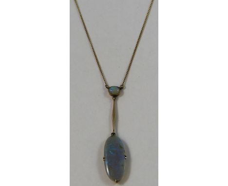 An Edwardian opal negligee pendant, claw set with an oval stone, bar above to a smaller stone, chain.