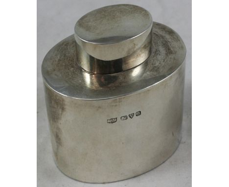 A silver tea caddy, Chester 1927, of plain oval form, pull off cover, height 8 cm, weight 2.5 oz.