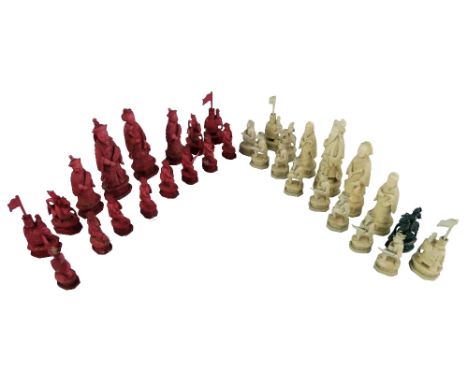 A late 19th century Cantonese carved ivory figural chess set, the kings and queens as emperors and empresses, the bishops as 