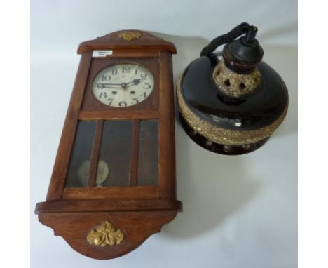 West German UFO type centre light fitting and an early 20th century striking wall clock (2)  