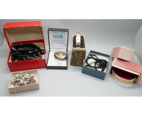Two rolled gold bangles, boxed, French jet, a Whitby jet bracelet, a plated collar necklace, glass bead necklace, an enamelle