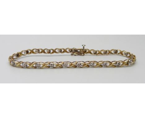 A 9ct gold and diamond tennis bracelet, 4.4g, 18cm