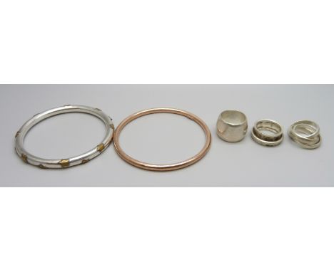 Three silver rings, a silver bangle with star design and a rose gold plated silver bangle, 51g