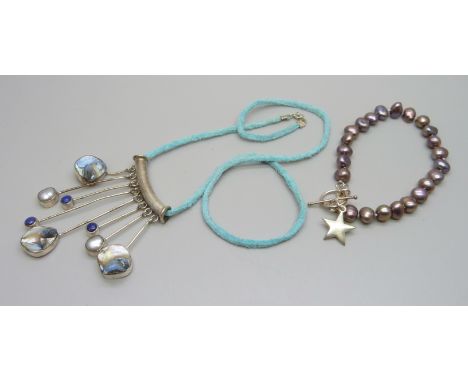 A silver set lapis lazuli, abalone and pearl pendant and a pearl bracelet with silver mounts