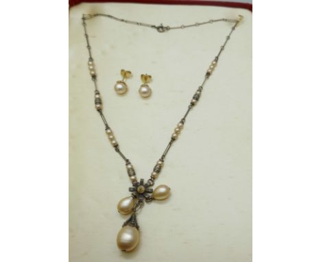 A Ciro pearl necklace a pair of earrings, in a case