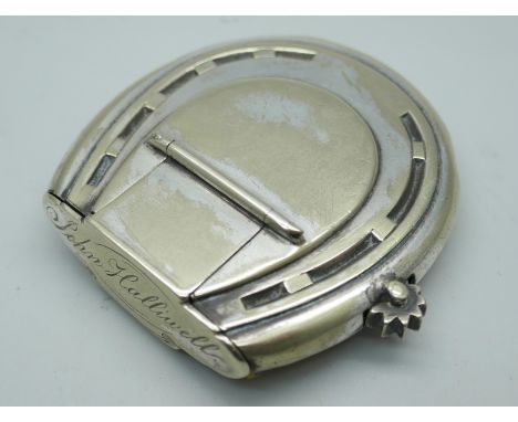 A novelty silver plated horseshoe shaped vesta case/lighter combination, 5cm x 5cm