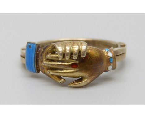 A 9ct gold and enamel clasped hands ring, opens to reveal an enamel heart, 3.6g, L/M