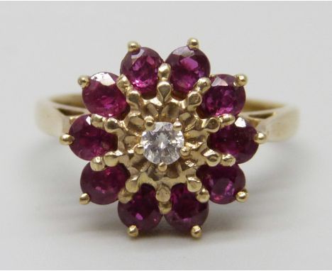 A 9ct gold, red stone and diamond ring, 2.8g, K