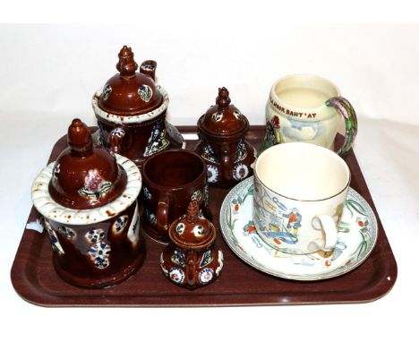 A Victorian treacle glazed barge ware teapot with other similar items together with a musical tankard and Farmers Arm's cup a