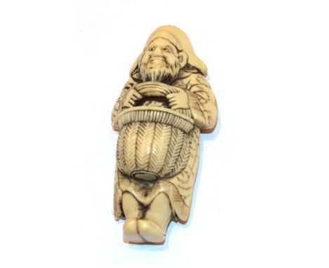 Japanese ivory netsuke, foreigner with basket, 7.5cm high .  Weight 39g. All over wear and discolouration