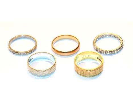 An 18 carat gold band ring, finger size O, a 9 carat white gold patterned band ring, finger size P; a band ring, stamped 'PAL