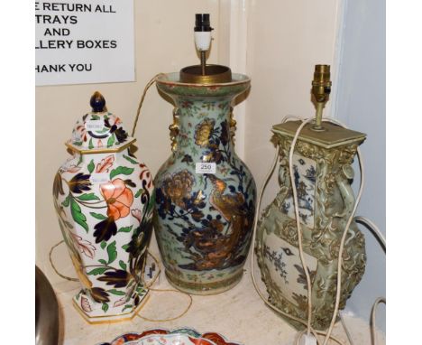 Two Chinese celadon ground table lamps, 43cm high, converted from vases, together with a Royal Worcester Chinese style vase a