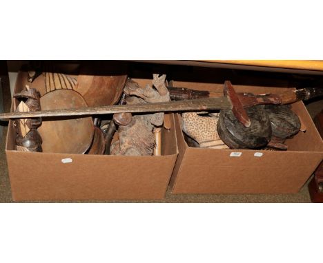 A quantity of South African souvenir carvings, including a figure of a Zulu warrior, five animal figures, three feast bowls, 