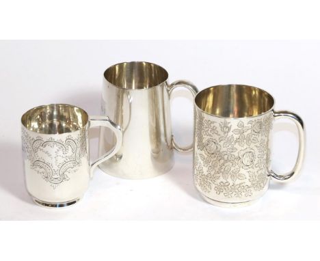 Three silver mugs, the first by Ackroyd Rhodes, London, 1903, cylindrical, engraved with foliage and an inscription, 9.5cm hi