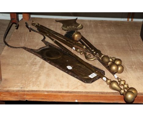 A set of three brass fire tools, three individual fire tools and an Arts &amp; Crafts wall plaque  
