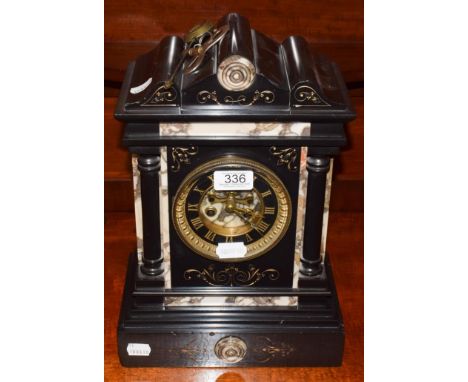 A Victorian black slate and marble mantle clock with Roman dial and with visible escapement, 35cm high.  Various chips to bla