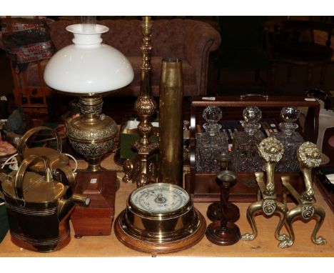 A brass oil lamp, two brass watering cans, a 19th century tea-caddy, a brass wall barometer, a pair of brass fire dogs, a mod