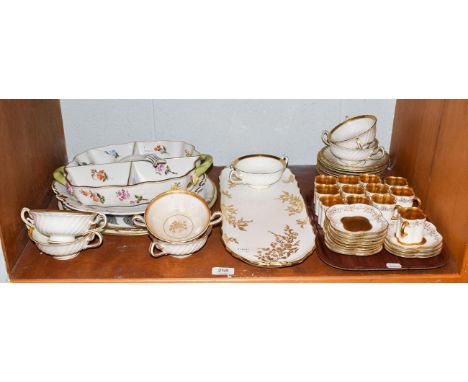 Twelve Coalport coffee cans and saucers, together with seven Minton's twin-handled cups and saucers, a Herend twin-handled fo